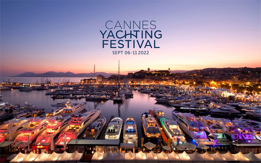 Cannes harbour in the evening with illuminated yachts