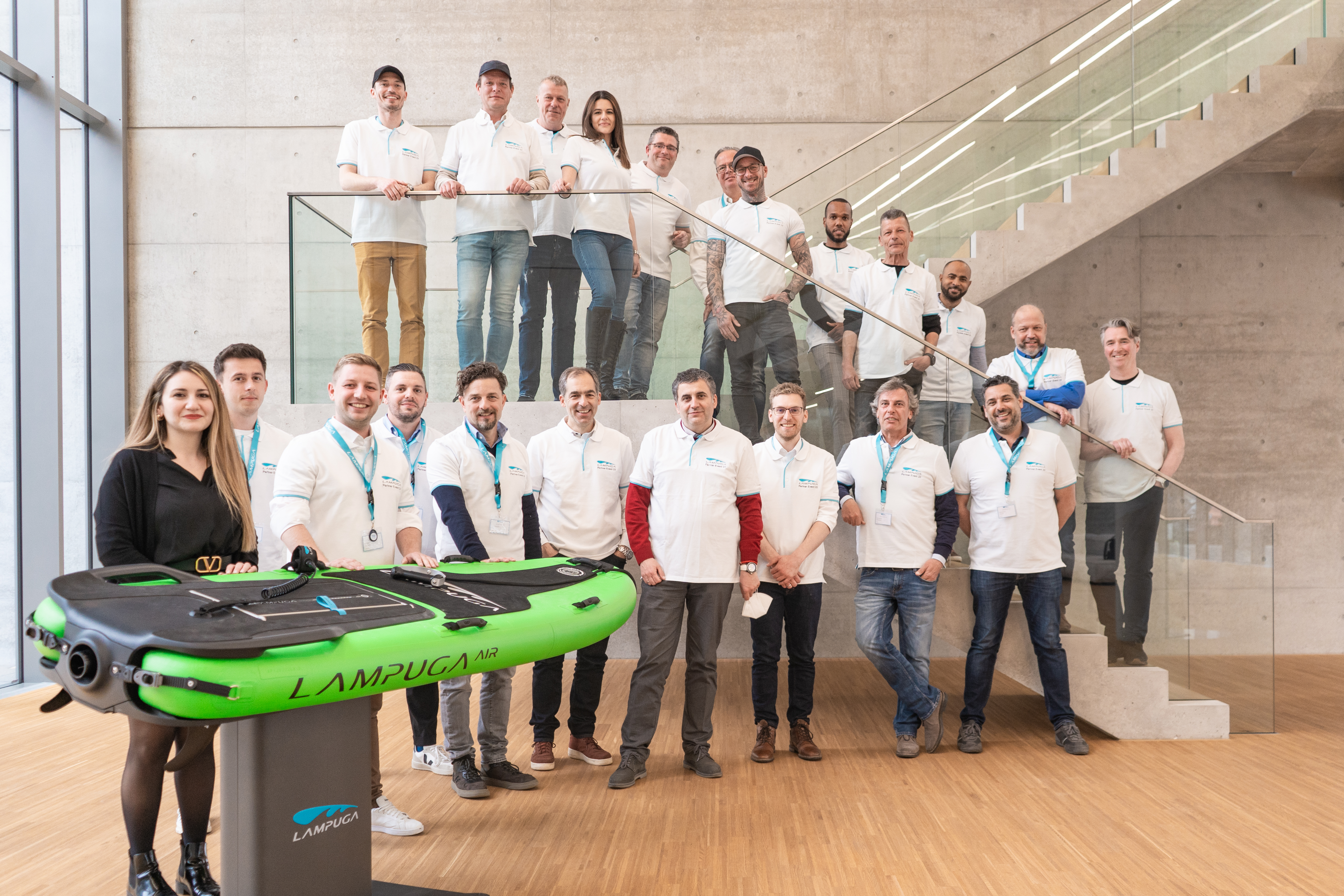 Lampuga employees and dealers posing for a group photo at the new headquarters in Karlsruhe 